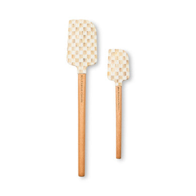 Set of two mocha check silicone spatulas with beech wood handles in a kitchen setting.