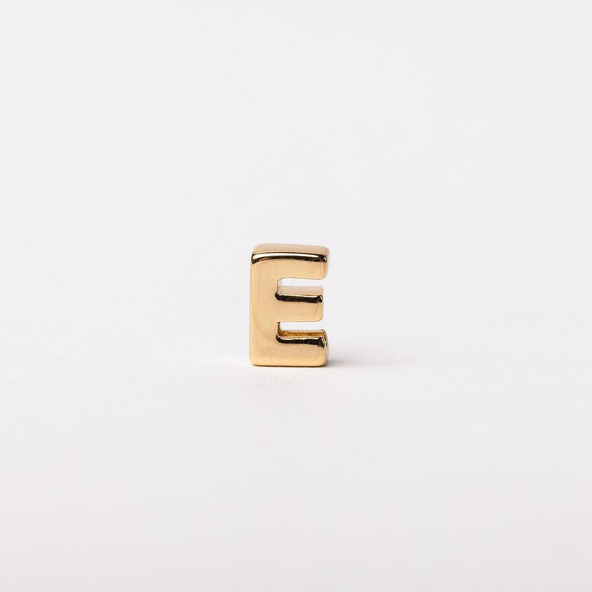 Gold-toned letter E charm with a polished, minimalist block silhouette.