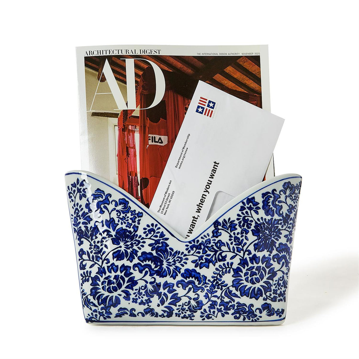 Chinoiserie hand-painted blue and white floral porcelain letter holder with mail and a magazine.