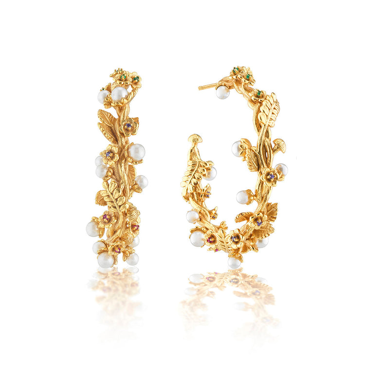 Meadow Grande hoop earrings featuring a pearl accent on an 18K gold plated brass silhouette.