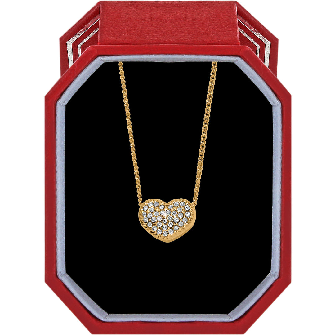 Gold-plated Illumina Celeste Heart Petite Necklace with crystals in a red octagonal gift box.