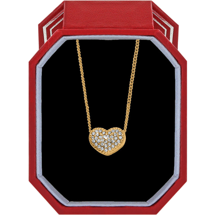 Gold-plated Illumina Celeste Heart Petite Necklace with crystals in a red octagonal gift box.