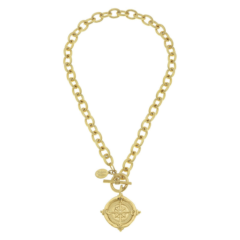 Handcast 24k gold-plated chain necklace with a compass pendant and front toggle clasp.