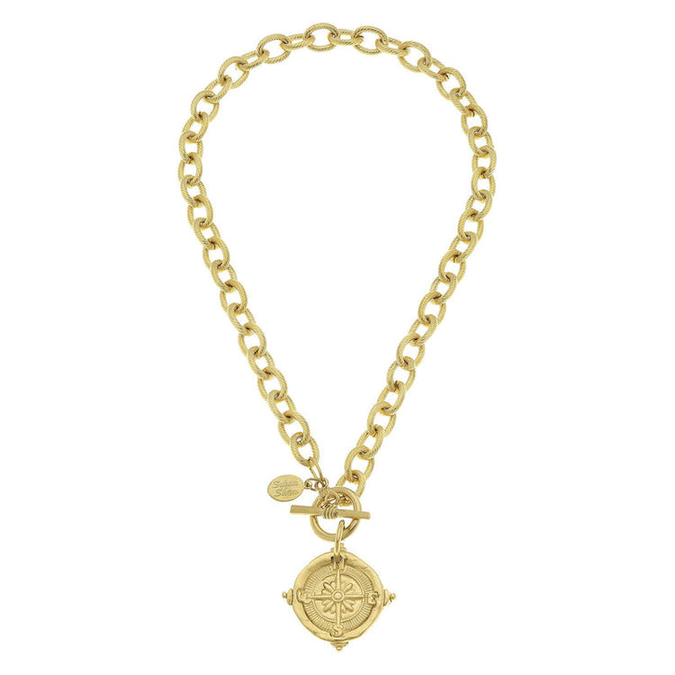 Handcast 24k gold-plated chain necklace with a compass pendant and front toggle clasp.