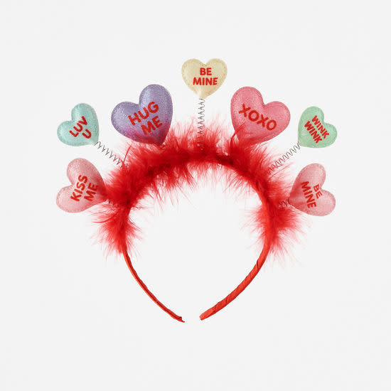 Black PVC headband with red heart-shaped conversation hearts attached to an elastic band.