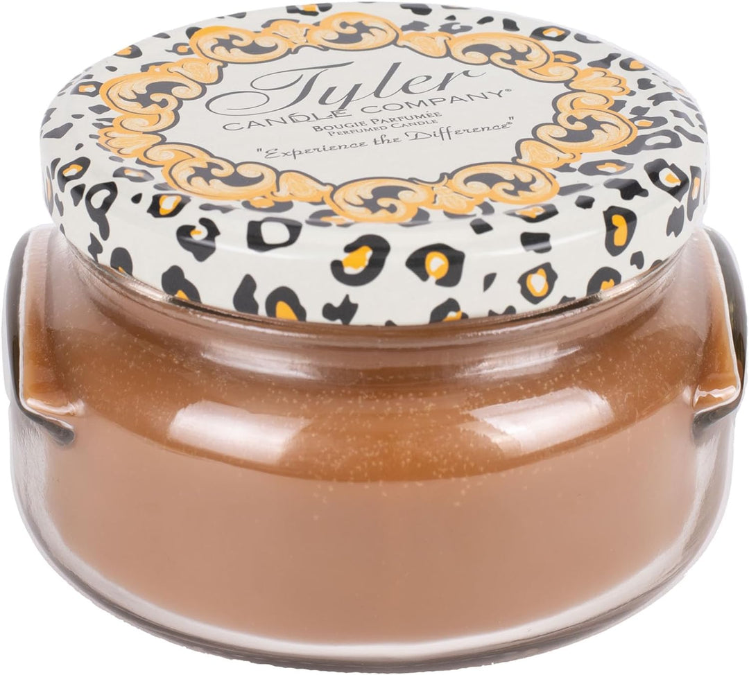 Tyler Candle Company 3.4 oz Cowboy scented candle in a glass jar with a leopard print lid.