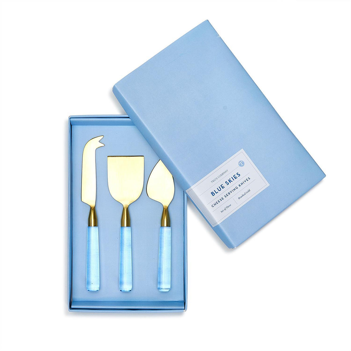 Set of three gold-tone cheese knives with blue acrylic handles in a light blue gift box.