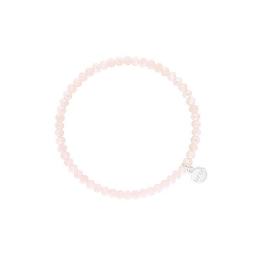 Stretchy beaded bracelet with faceted nude glass beads.
