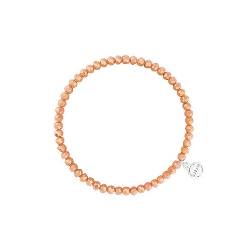 Stretchy beaded bracelet with faceted orange glass beads on a clear cord.