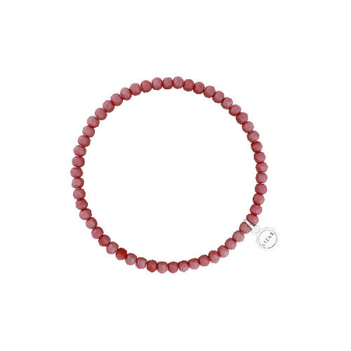 Red faceted glass bead stretchy bracelet with a beaded pattern.