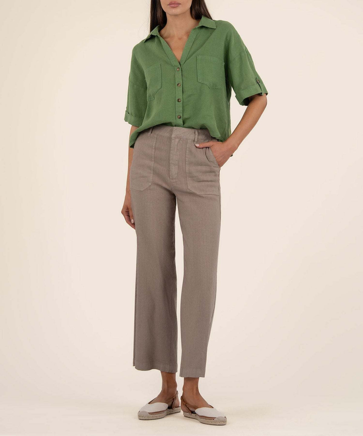 Ivy Breland boxy shirt in light beige linen-rayon blend with short sleeves and front button closure.