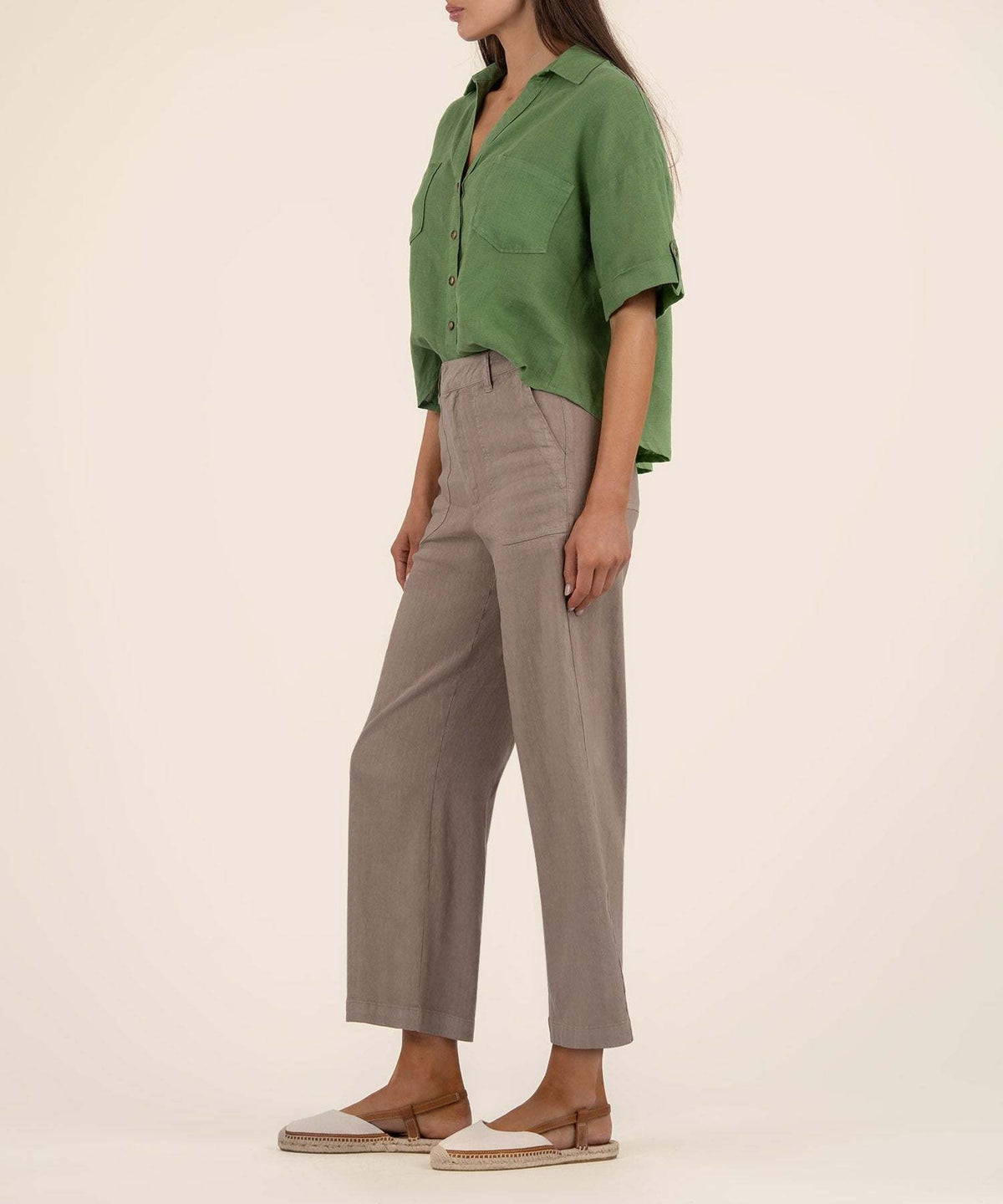 Ivy Breland boxy linen rayon shirt with short sleeves, button front closure, and functional chest pockets in a relaxed silhouette.