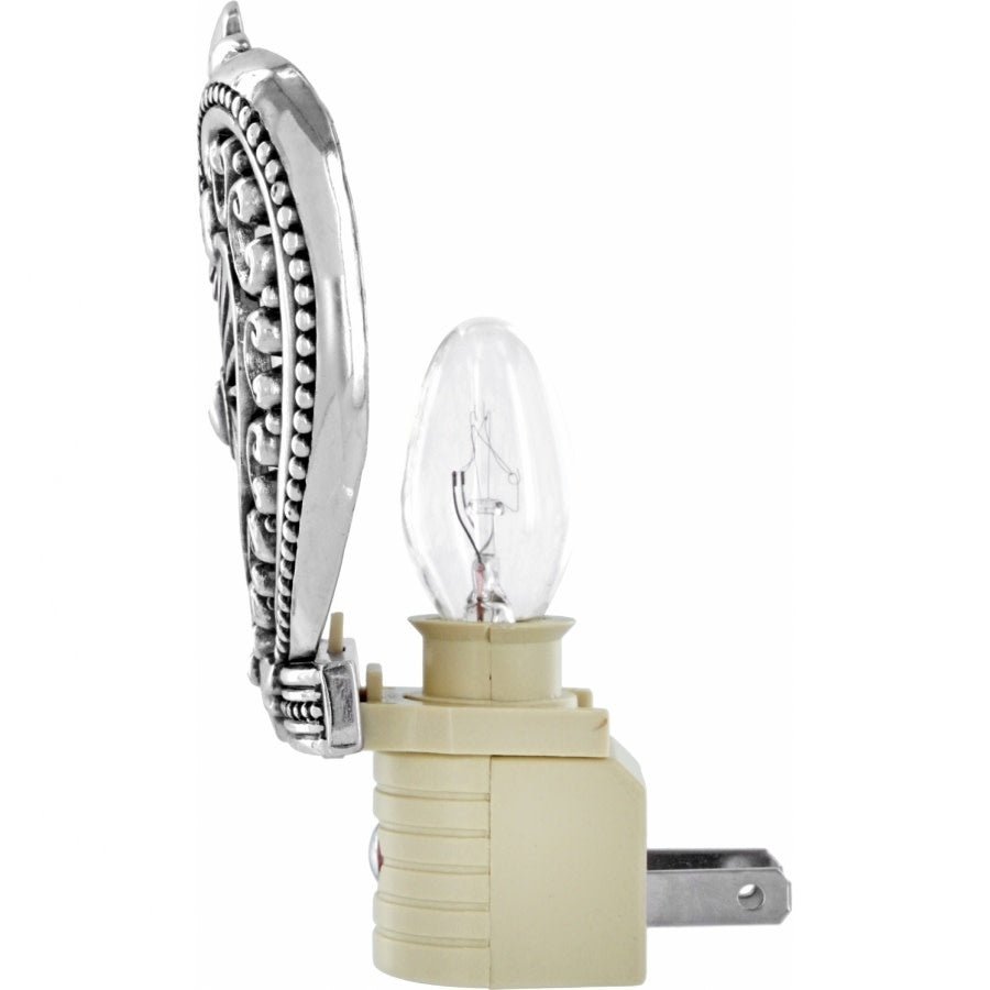 Silver plated heart-shaped nightlight with a visible bulb inside.