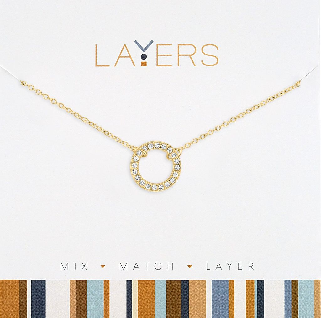 Gold-tone chain necklace featuring a circular pendant pavé-set with clear cubic zirconia crystals.