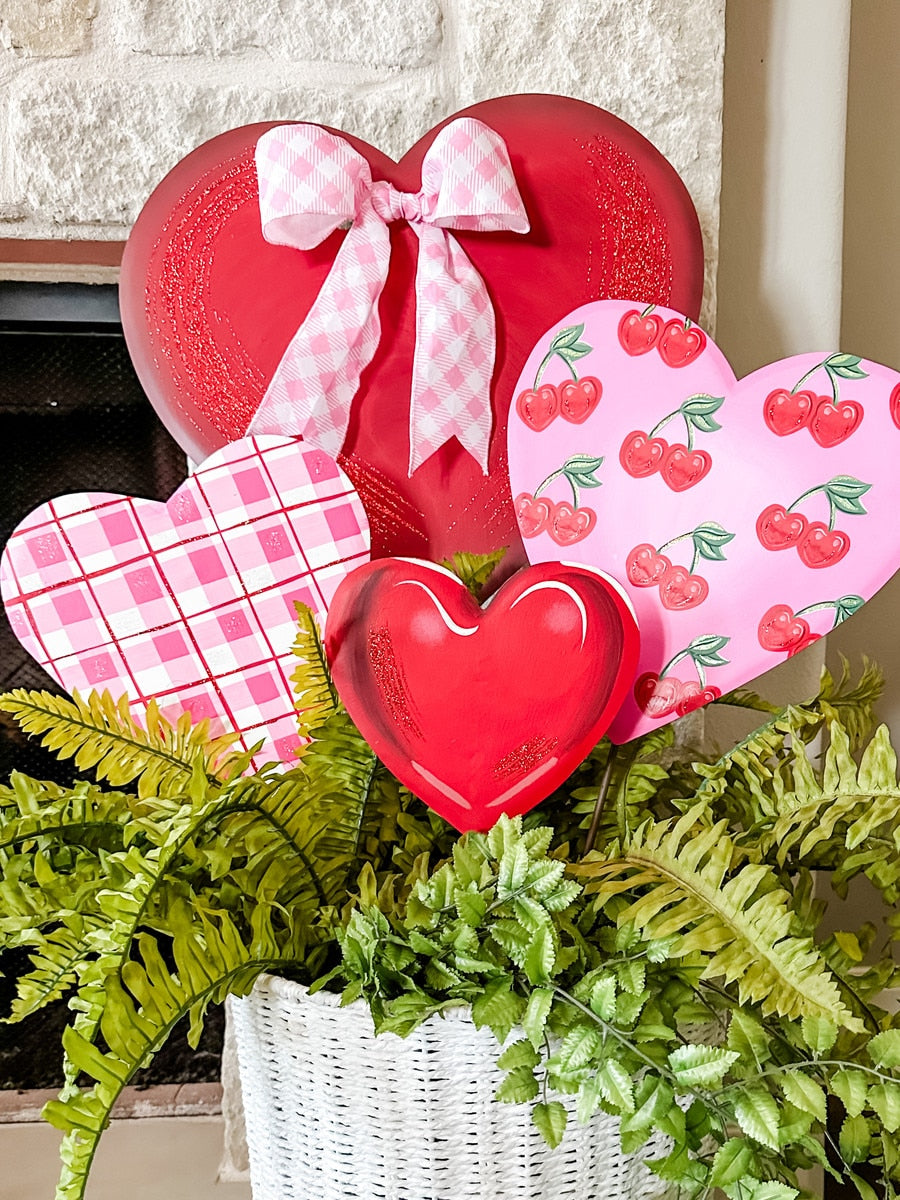 Metal garden stake with a pink cherry heart top on an eight-inch square base.