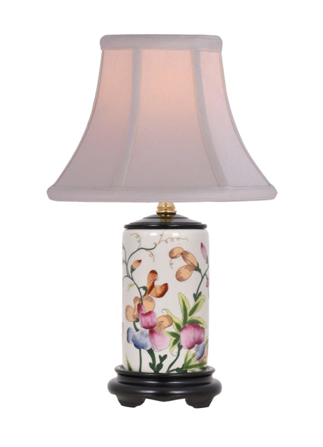 White porcelain lamp with floral pencil box base featuring soft off-white shade