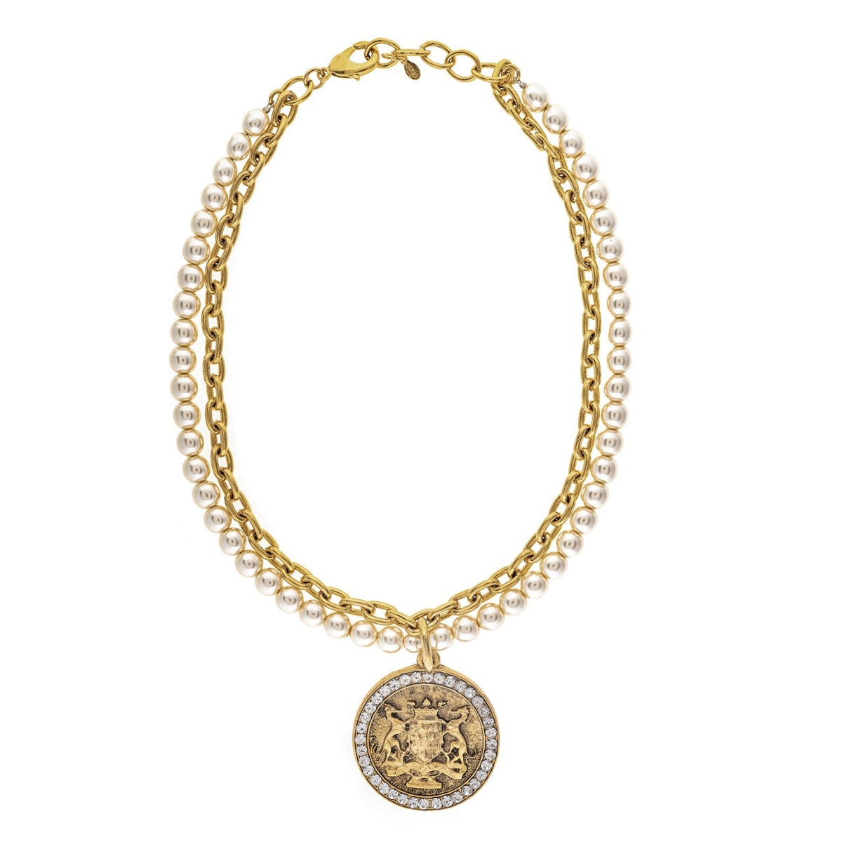 Multi-strand necklace with a gold-tone chain, white pearls, and a crystal-rimmed coin pendant.
