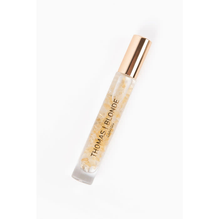 High-Roller unisex perfume stick with a silver metallic body and black cap.