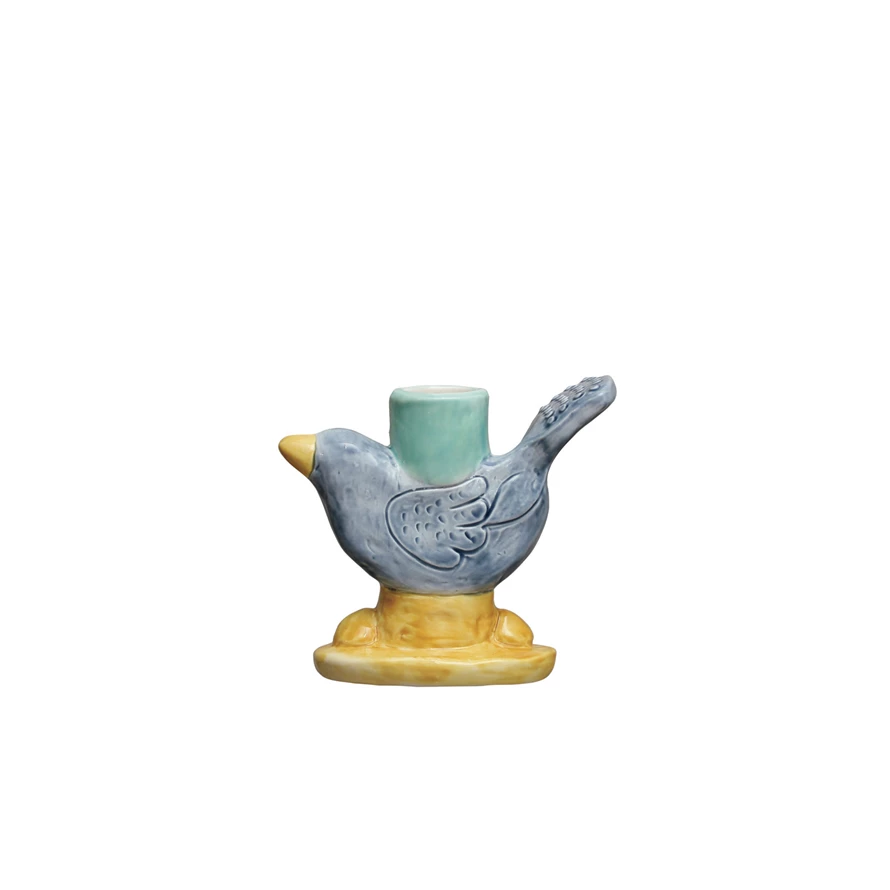 Reactive glaze stoneware bird taper holder with a tapered silhouette.