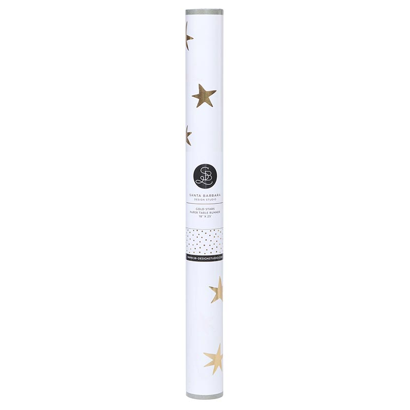 Rolled white paper table runner with gold foil star patterns and Santa Barbara Design Studio label.