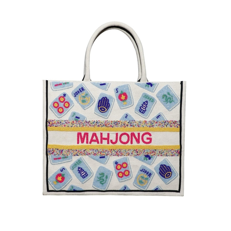 Ivory tote bag with hand-beaded mahjong tiles, fuchsia "MAHJONG" text, and colorful beaded accents.