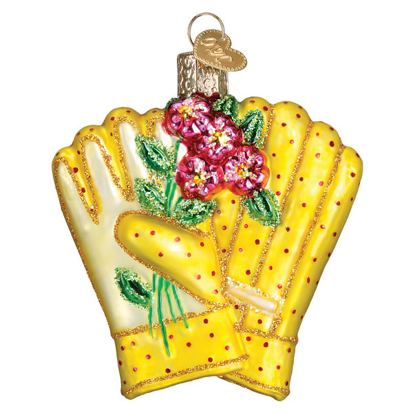 Yellow glass gardening gloves ornament with red polka dots and pink floral accents.