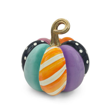 Medium pumpkin-shaped resin decor with whimsical patchwork patterns in warm autumn tones.