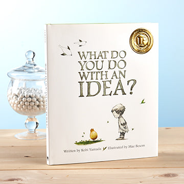 Hardcover journal titled 'What Do You Do With An Idea' with a white cover and black text.