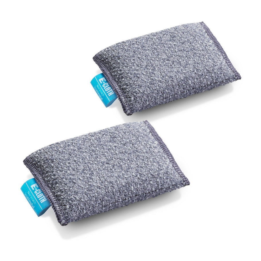 Two grey E-Cloth non-scratch scrubbing pads for cookware and cooktops on a white background.