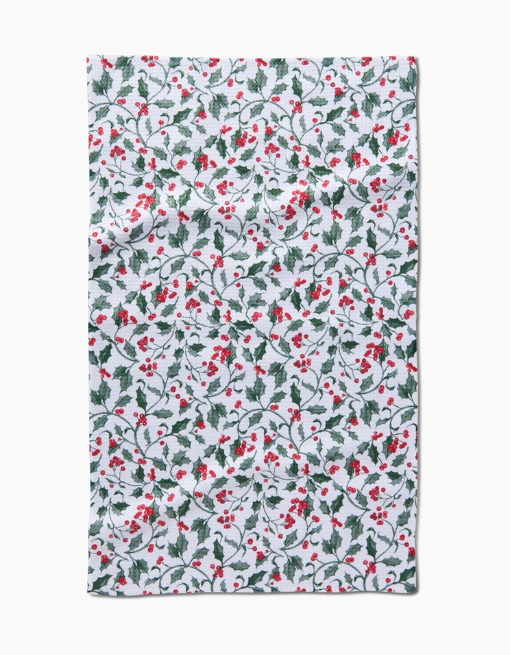 Holiday tea towel with waffle weave construction in red featuring a festive snowman pattern.