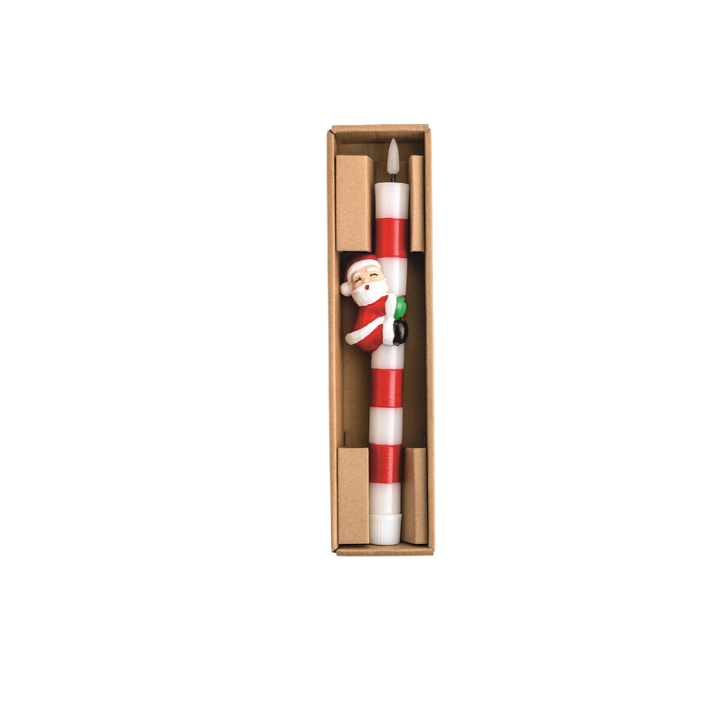 Flameless red and white striped taper candle with a Santa Claus resin hugger in a gift box.