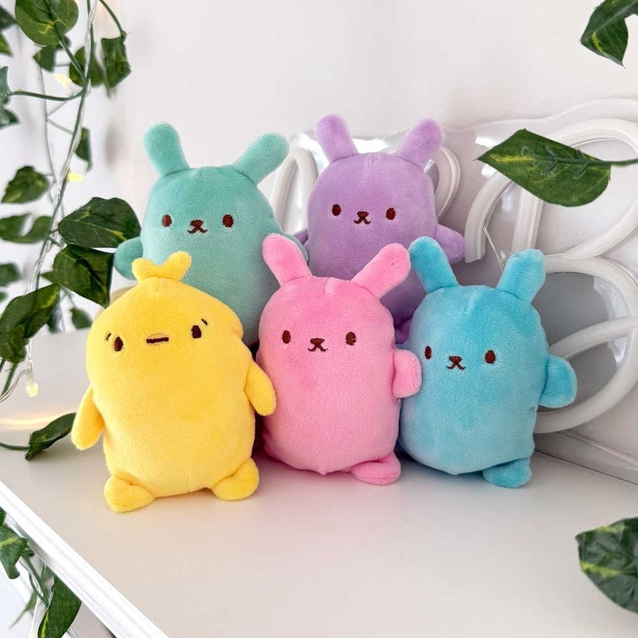Easter bunny plush with thin shell filled with squishy bubble balls in pastel colors.