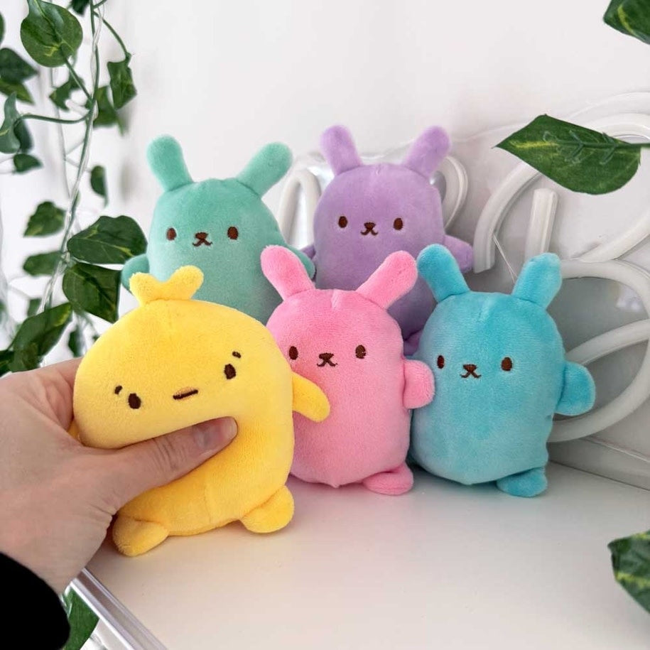 Easter bunny plush with thin fabric shell filled with squishy bubble balls inside.
