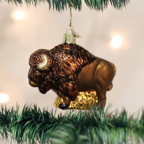 Buffalo ornament with natural wood finish and carved buffalo head silhouette