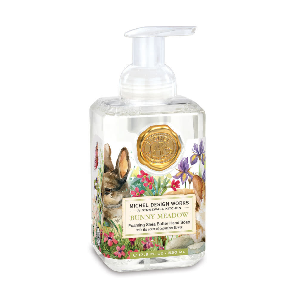 Foaming hand soap dispenser in a clear bottle with white liquid.