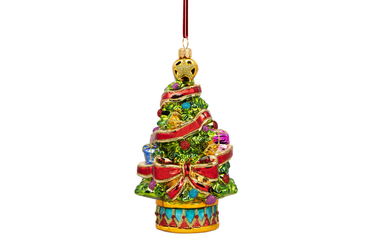 Hand-blown glass Christmas tree ornament with a green pine branch shape.