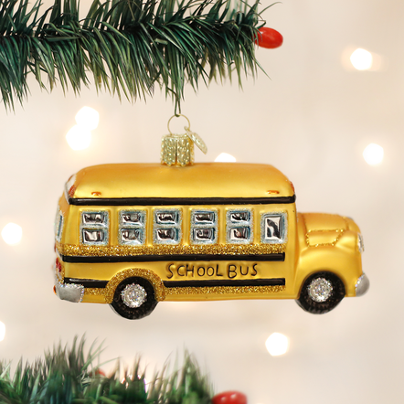 Glass school bus ornament with silver interior, hand-painted bright colors, glitter accents, and rounded silhouette.