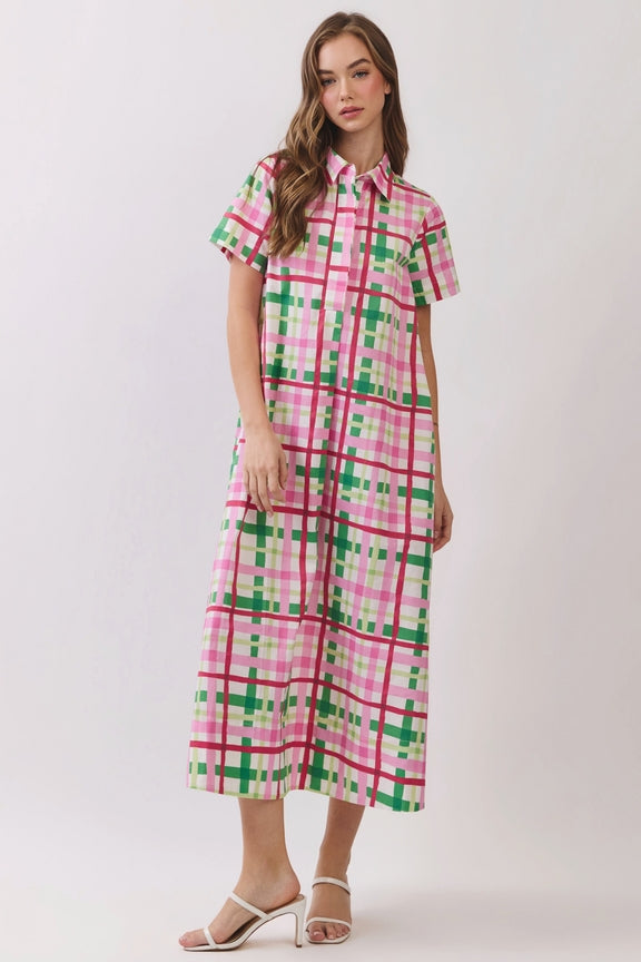 Woman wearing the Amara Plaid Button Down Midi Dress in a pink and green plaid pattern.