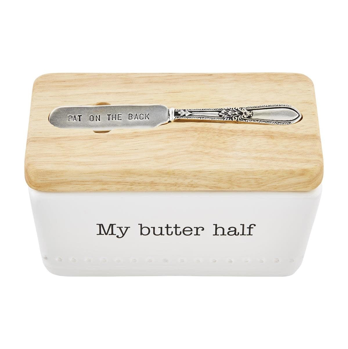 Ceramic butter dish with wood lid holding silverplate spreader