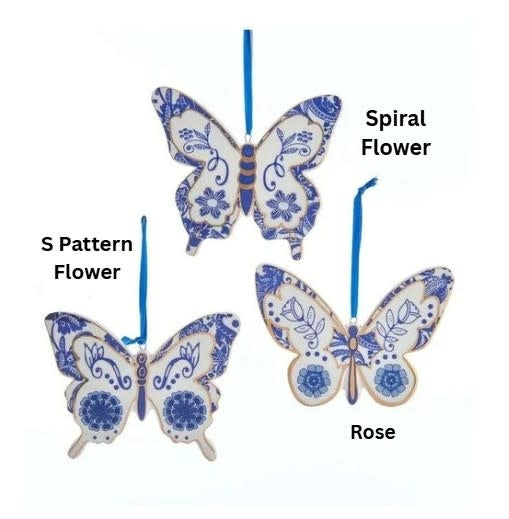Porcelain butterfly ornament with indigo blue and white wings featuring metallic gold accents.
