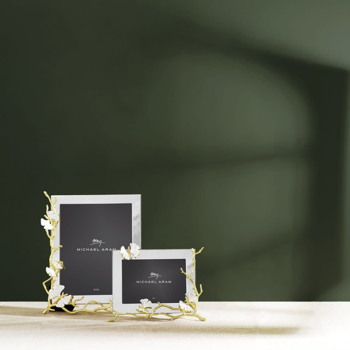 Gold reflective butterfly frame with white enamel accents