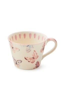 Handmade stoneware mug with a butterfly hill landscape illustration in earth tones.