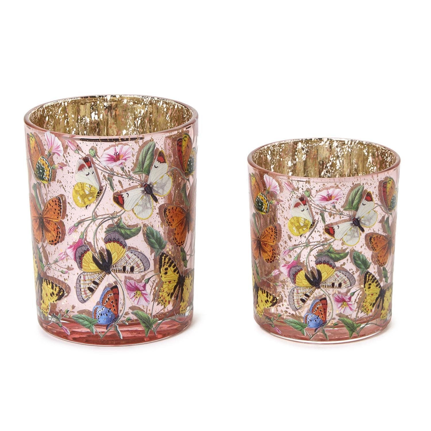 Antiqued glass candleholder featuring an intricate butterfly silhouette designed for tealights.