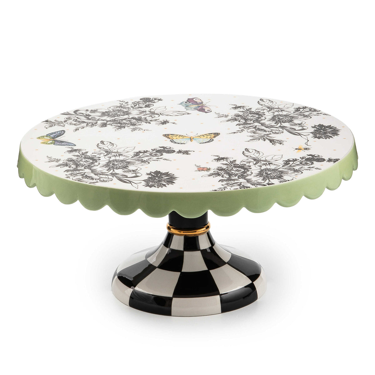 Large ceramic pedestal platter with butterfly toile pattern on checked base and pistachio scalloped edges.
