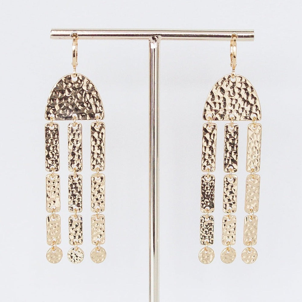 Xandra hammered gold statement earring with a textured finish.