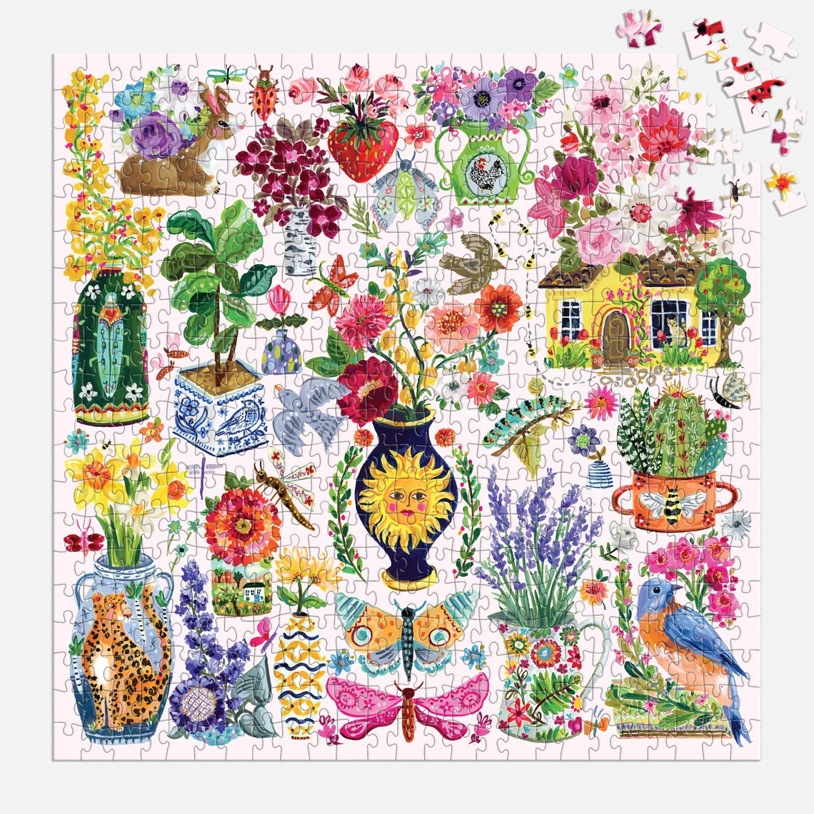 Buzzy Bouquets 500 piece puzzle featuring a colorful collage of flowers, animals, and a cottage.