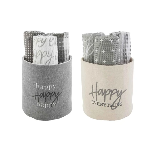 Gray and white cotton towels with patterns rolled in a canvas bucket labeled Happy Everything