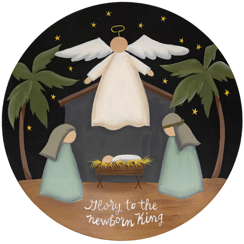 Glory to the Newborn King nativity plate featuring a gold-colored silhouette with red and blue accents on white ceramic.