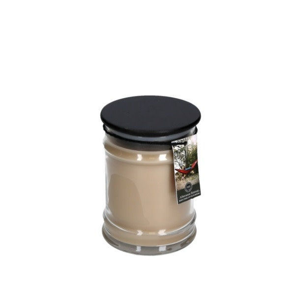 8oz glass jar candle with black ceramic lid featuring Afternoon Retreat woody fragrance