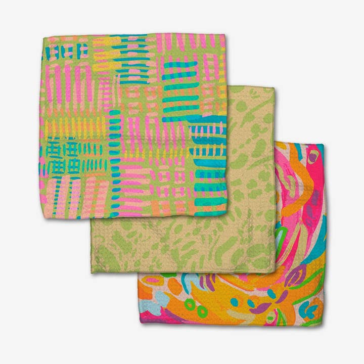 Set of three waffle weave dishcloths in white with single-sided print designs.